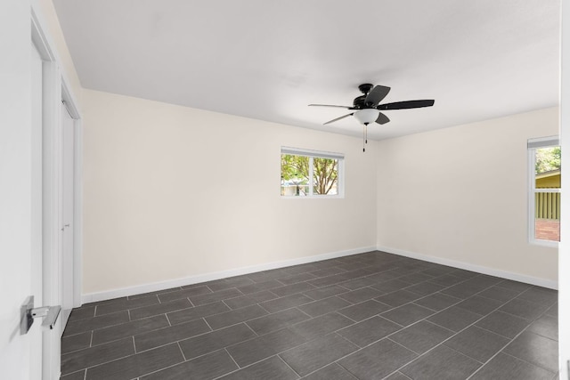 4535 Pack Saddle Pass, Austin, TX 78745 - spare room featuring a ceiling fan and baseboards