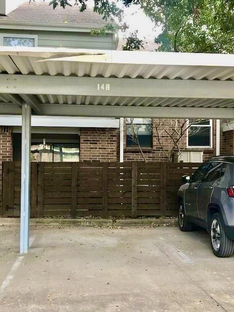 covered parking lot with fence