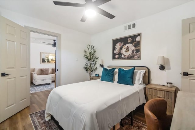bedroom featuring wood finished floors and ceiling fan