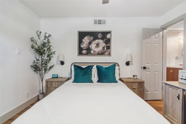 bedroom with wood finished floors and a ceiling fan