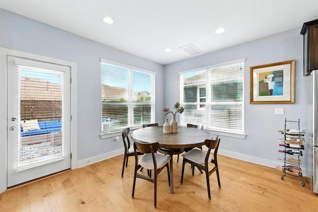 7308 Oberon St, Austin, TX 78741 - dining area with light wood-style floors and recessed lighting