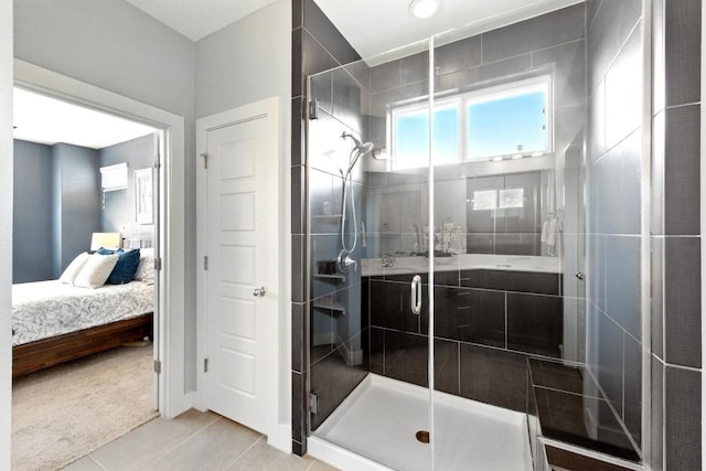 7308 Oberon St, Austin, TX 78741 - full bathroom featuring ensuite bathroom, a stall shower, and tile patterned floors