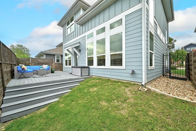 7308 Oberon St, Austin, TX 78741 - rear view of house featuring an outdoor living space, board and batten siding, and a deck