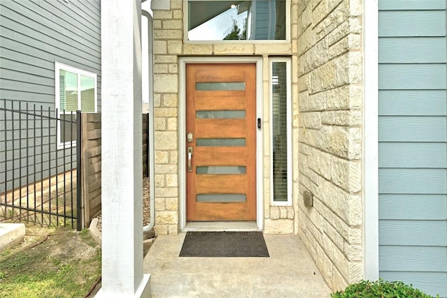 7308 Oberon St, Austin, TX 78741 - entrance to property featuring stone siding