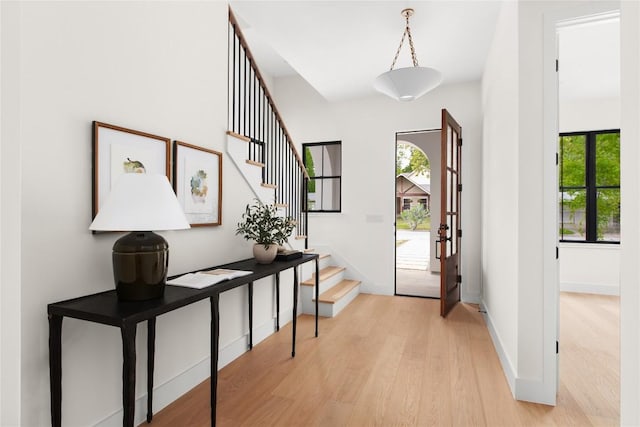 1703 Madison Ave, Austin, TX 78757 - entrance foyer featuring healthy amount of natural light, stairs, and light wood-type flooring