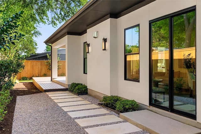 1703 Madison Ave, Austin, TX 78757 - view of exterior entry featuring stucco siding and fence