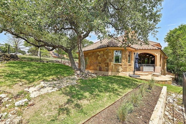 2600 Grapevine Springs Cv, Georgetown, TX 78628 - back of house featuring stone siding and a tile roof