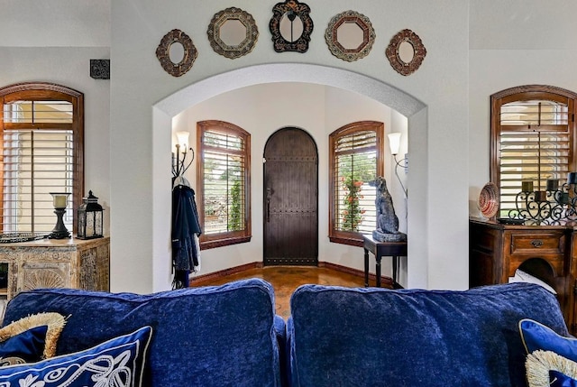 2600 Grapevine Springs Cv, Georgetown, TX 78628 - foyer with arched walkways, baseboards, and wood finished floors