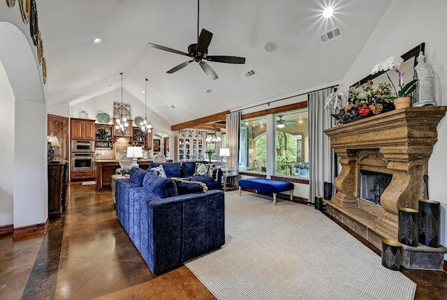 2600 Grapevine Springs Cv, Georgetown, TX 78628 - living area with a ceiling fan, finished concrete flooring, a stone fireplace, plenty of natural light, and high vaulted ceiling