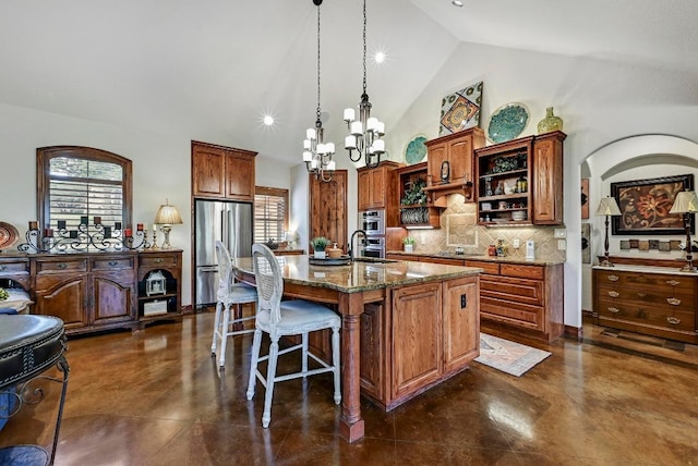 2600 Grapevine Springs Cv, Georgetown, TX 78628 - kitchen featuring freestanding refrigerator, open shelves, tasteful backsplash, dark stone countertops, and finished concrete floors