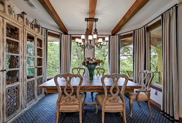 2600 Grapevine Springs Cv, Georgetown, TX 78628 - dining space featuring a chandelier and beamed ceiling