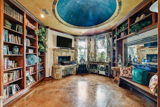 2600 Grapevine Springs Cv, Georgetown, TX 78628 - living area featuring a fireplace, crown molding, and a raised ceiling