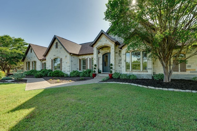 1186 Ranchers Club Ln, Driftwood, TX 78619 - view of front of home with stone siding and a front lawn