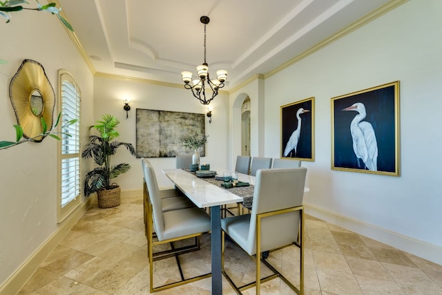 1186 Ranchers Club Ln, Driftwood, TX 78619 - dining area featuring crown molding, healthy amount of natural light, a chandelier, arched walkways, and a tray ceiling