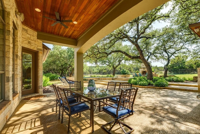 1186 Ranchers Club Ln, Driftwood, TX 78619 - view of patio / terrace featuring ceiling fan, outdoor dining space, and view of scattered trees