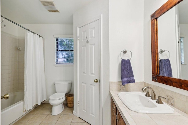 bathroom featuring toilet, shower / bath combo, tile patterned flooring, and vanity
