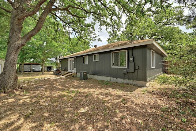 136 Shadow Oak Dr, Bastrop, TX 78602 - view of home's exterior featuring cooling unit and entry steps
