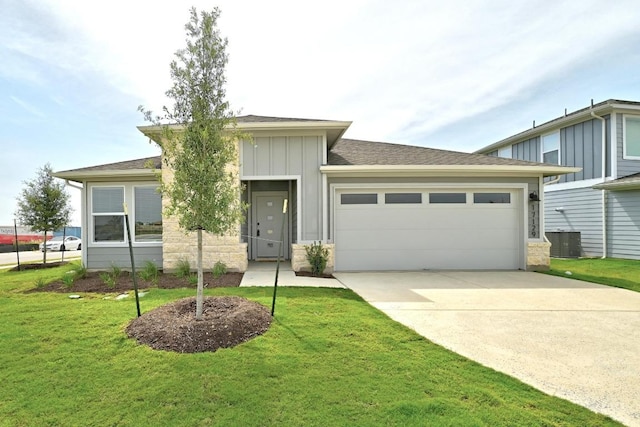 17129 Loch Rd, Pflugerville, TX 78660 - view of front of property featuring an attached garage, board and batten siding, concrete driveway, a front yard, and stone siding
