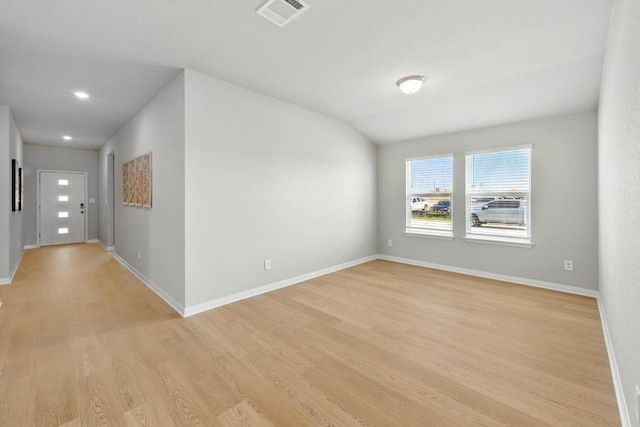unfurnished room featuring light wood-style flooring, baseboards, and recessed lighting
