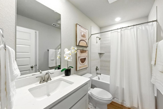 17129 Loch Rd, Pflugerville, TX 78660 - bathroom featuring vanity, shower / bath combination with curtain, wood finished floors, and recessed lighting
