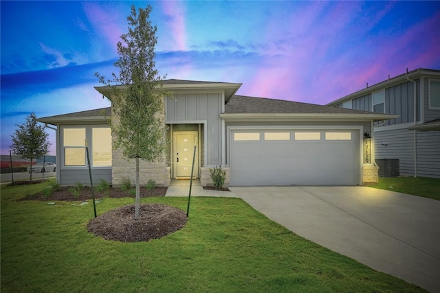 17129 Loch Rd, Pflugerville, TX 78660 - view of front of house with board and batten siding, concrete driveway, an attached garage, a yard, and roof with shingles