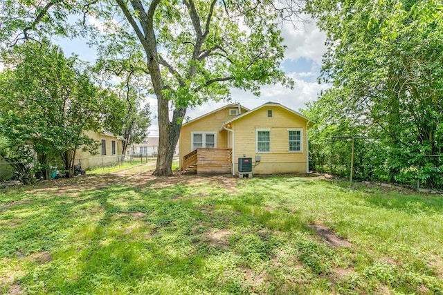 rear view of house featuring a deck