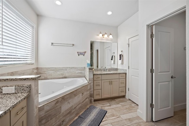 21513 Santa Carlo Ave, Lago Vista, TX 78645 - full bath featuring vanity, a whirlpool tub, and recessed lighting
