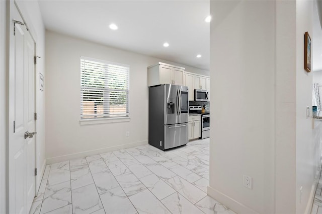 21513 Santa Carlo Ave, Lago Vista, TX 78645 - kitchen featuring appliances with stainless steel finishes, light marble finish flooring, recessed lighting, and white cabinets