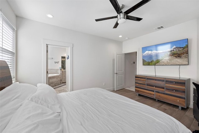 bedroom featuring wood finished floors, recessed lighting, ceiling fan, ensuite bathroom, and baseboards