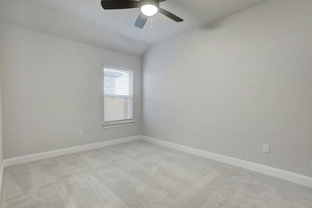9721 Eloquence Dr, Manor, TX 78653 - spare room with light carpet, lofted ceiling, baseboards, and ceiling fan