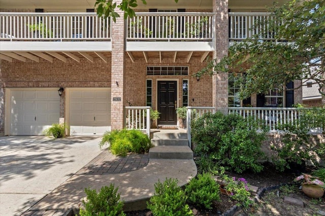 2932 Persimmon Valley Trl, Austin, TX 78732 - entrance to property with a garage, brick siding, concrete driveway, and a balcony