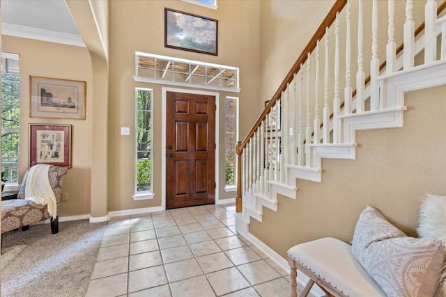 2932 Persimmon Valley Trl, Austin, TX 78732 - foyer featuring stairs, baseboards, ornamental molding, and light tile patterned floors
