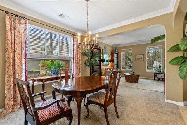 2932 Persimmon Valley Trl, Austin, TX 78732 - dining space featuring ornamental molding, baseboards, a chandelier, and light carpet