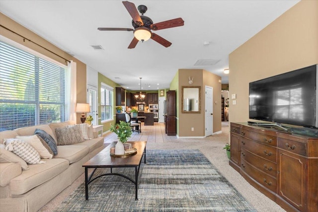 2932 Persimmon Valley Trl, Austin, TX 78732 - living area with a ceiling fan, baseboards, and light colored carpet