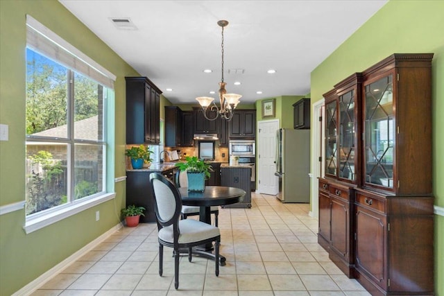 2932 Persimmon Valley Trl, Austin, TX 78732 - dining room featuring a chandelier, healthy amount of natural light, light tile patterned floors, and recessed lighting