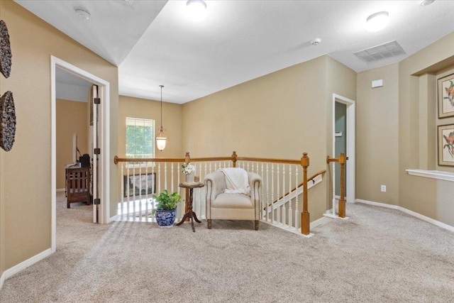 2932 Persimmon Valley Trl, Austin, TX 78732 - sitting room featuring an upstairs landing, carpet flooring, and baseboards