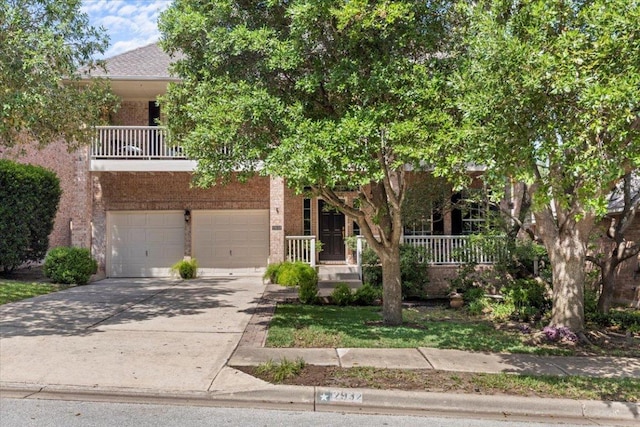 2932 Persimmon Valley Trl, Austin, TX 78732 - obstructed view of property featuring driveway, an attached garage, covered porch, and brick siding