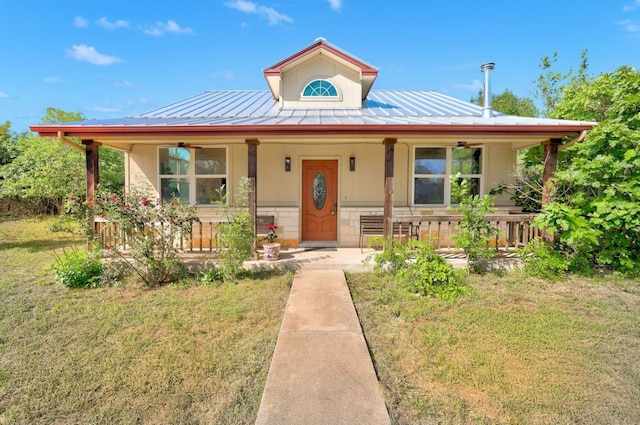 195 Live Oak, Liberty Hill, TX 78642 - country-style home featuring covered porch, metal roof, and a front yard