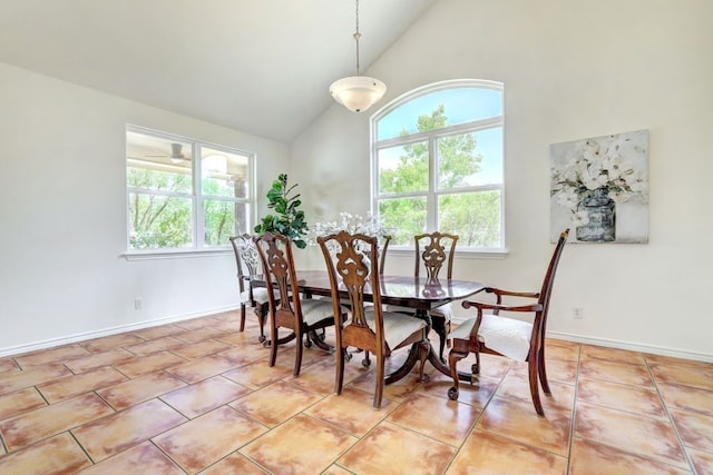 195 Live Oak, Liberty Hill, TX 78642 - dining space featuring high vaulted ceiling, light tile patterned floors, and baseboards