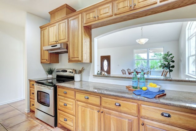 195 Live Oak, Liberty Hill, TX 78642 - kitchen featuring stainless steel electric stove, under cabinet range hood, light stone countertops, arched walkways, and light tile patterned floors