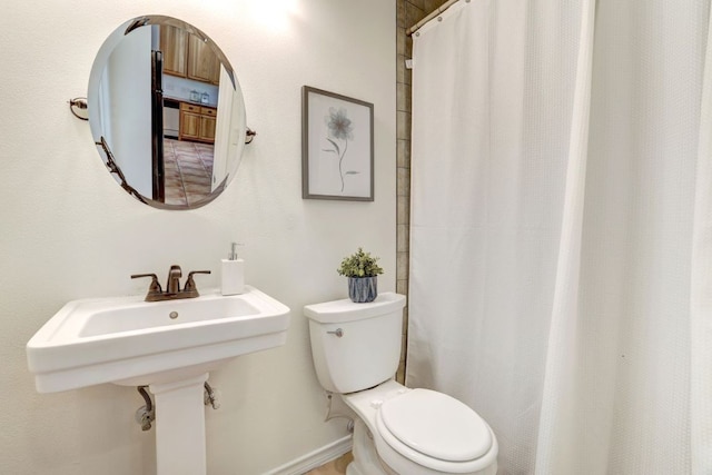 195 Live Oak, Liberty Hill, TX 78642 - full bathroom featuring toilet, a shower with shower curtain, and a sink
