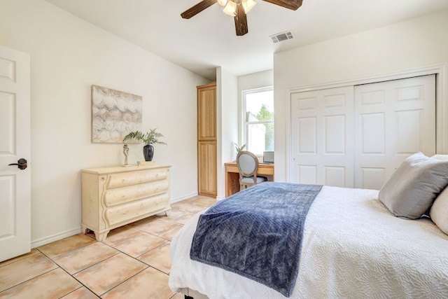 195 Live Oak, Liberty Hill, TX 78642 - bedroom featuring light tile patterned flooring, a closet, ceiling fan, and baseboards