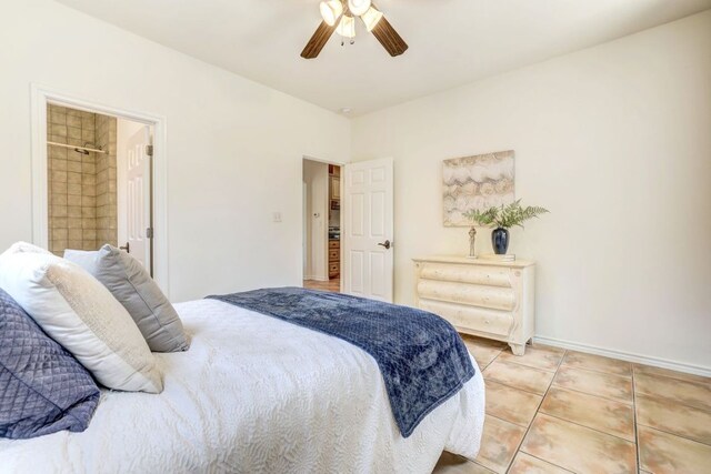 195 Live Oak, Liberty Hill, TX 78642 - bedroom featuring light tile patterned floors, ceiling fan, and baseboards