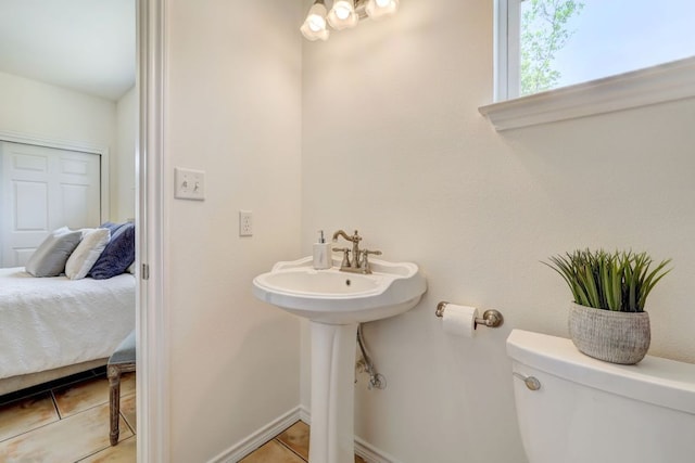 195 Live Oak, Liberty Hill, TX 78642 - bathroom featuring tile patterned floors, toilet, ensuite bathroom, and baseboards