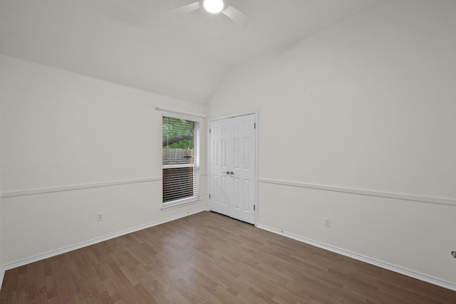 3408 Reims Ct, Austin, TX 78738 - unfurnished room featuring wood finished floors, lofted ceiling, and ceiling fan
