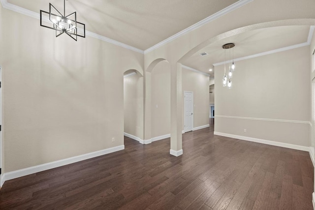 3408 Reims Ct, Austin, TX 78738 - unfurnished dining area with arched walkways, a chandelier, dark wood finished floors, baseboards, and crown molding