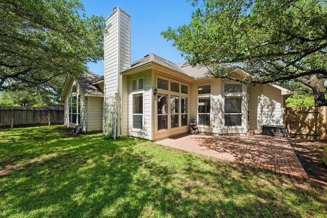 3408 Reims Ct, Austin, TX 78738 - rear view of property featuring a chimney and a patio area