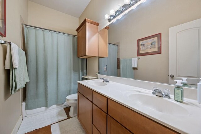 5401 Duval St Unit A & B, Austin, TX 78751 - bathroom featuring double vanity, toilet, and shower / bathtub combination with curtain