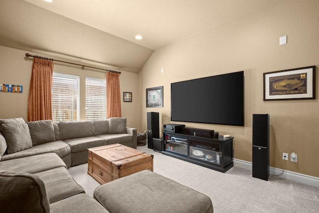 living room with light colored carpet, vaulted ceiling, and baseboards