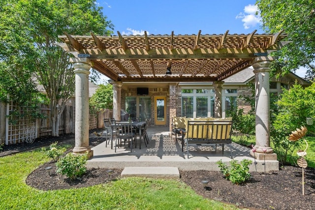 rear view of house featuring fence, a pergola, a patio, and brick siding